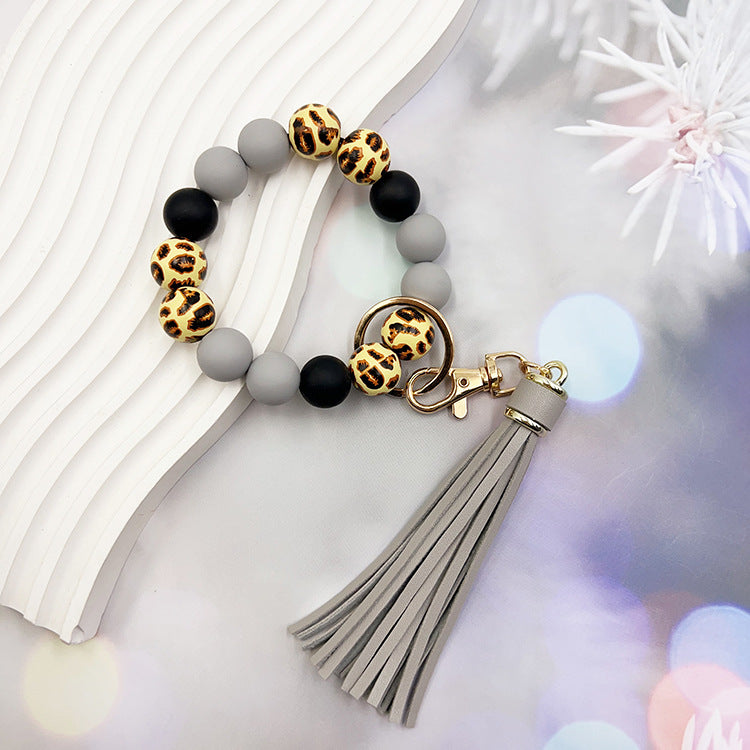 Wholesale Leopard Print Wood Beads Silicone Beaded Bracelet Tassel Key Ring